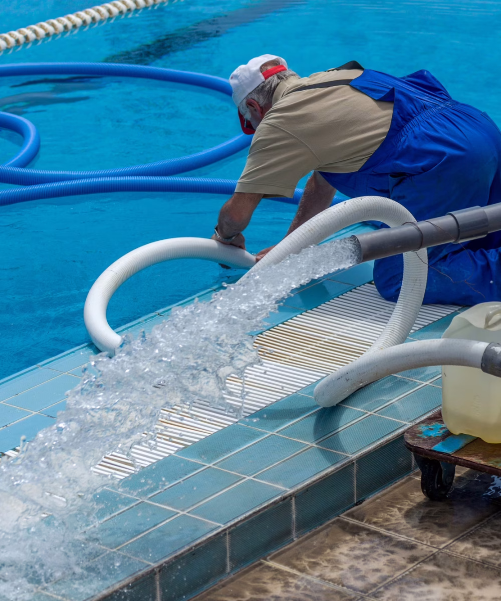 Cleaning the sports pool with a cleaning water pump. The water pump filters the water from the bottom of the pool, cleans from dirt and debris. The cleaning pump works with the pool.